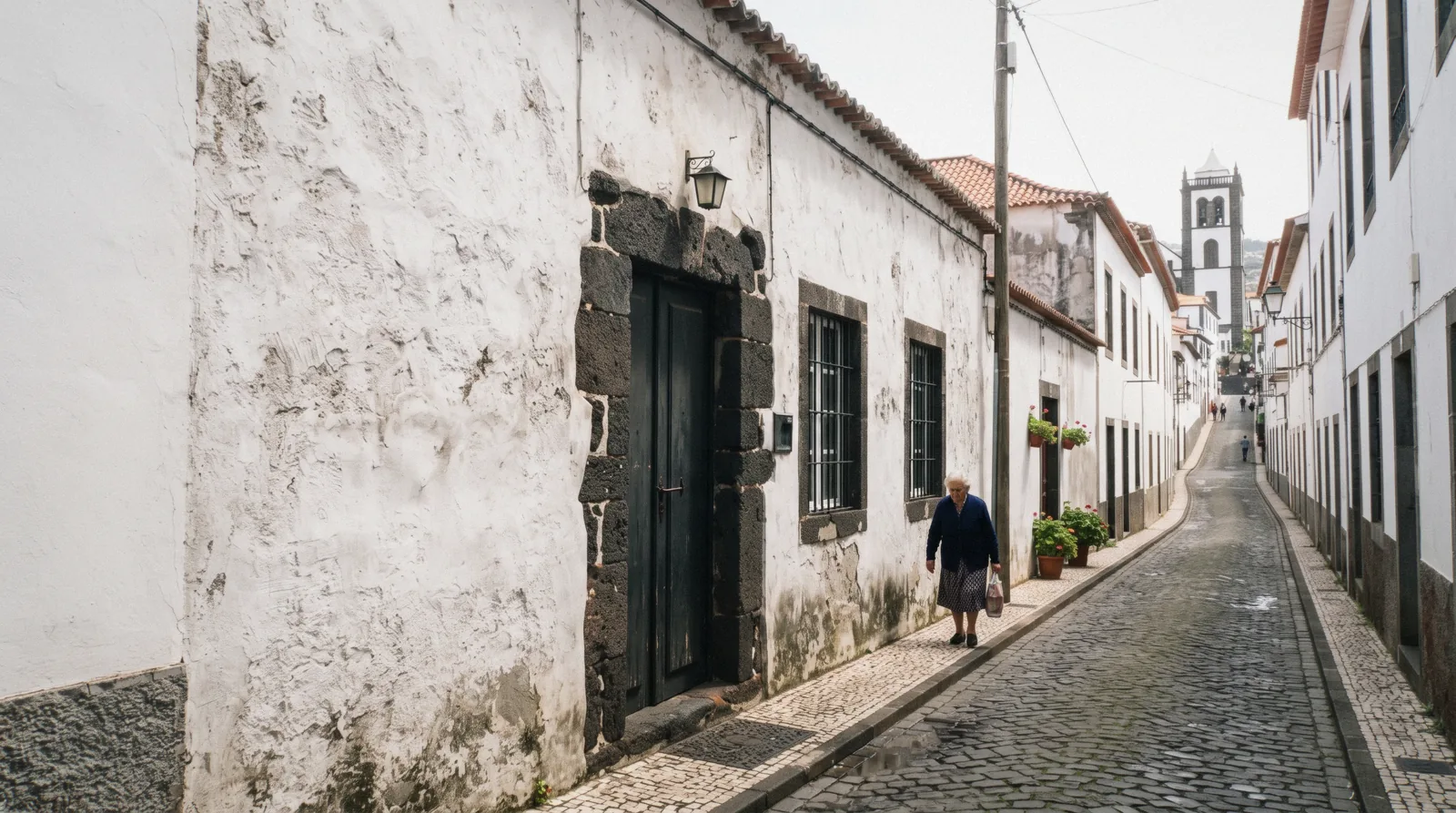 The whitewashed facade of the Museu de Arte Sacra do Funchal near the cathedral in Funchal, Madeira, Portugal