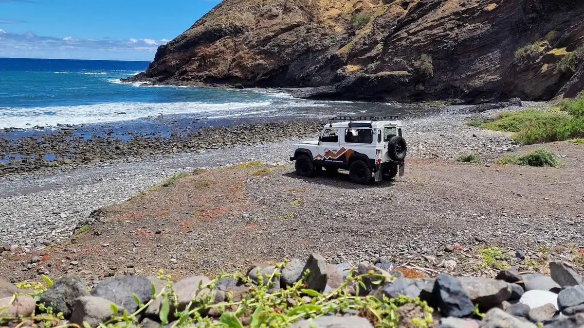 A 4x4 vehicle parked above the golden-sand beach of Porto Santo on a Porto Santo Island Highlights 4x4 tour in Porto Santo, Madeira, from Funchal, Portugal