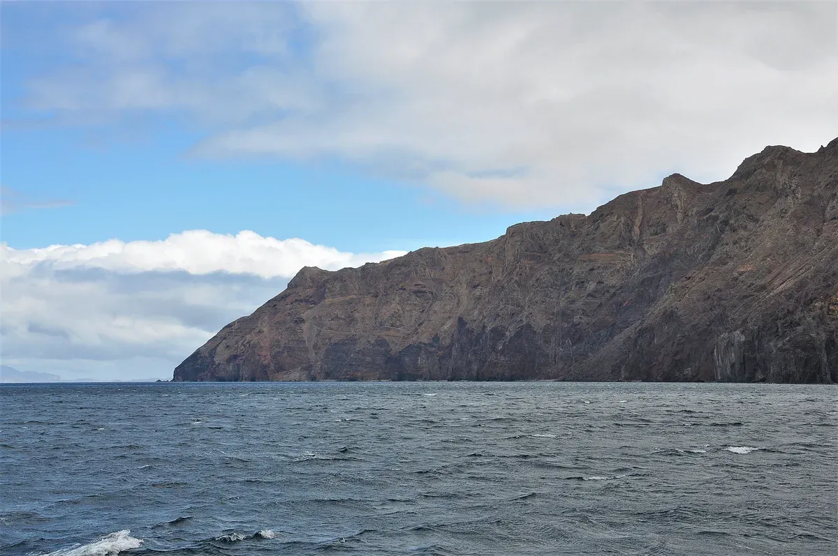 The volcanic cliffs of the Desertas Islands nature reserve, visited on a catamaran trip from Funchal