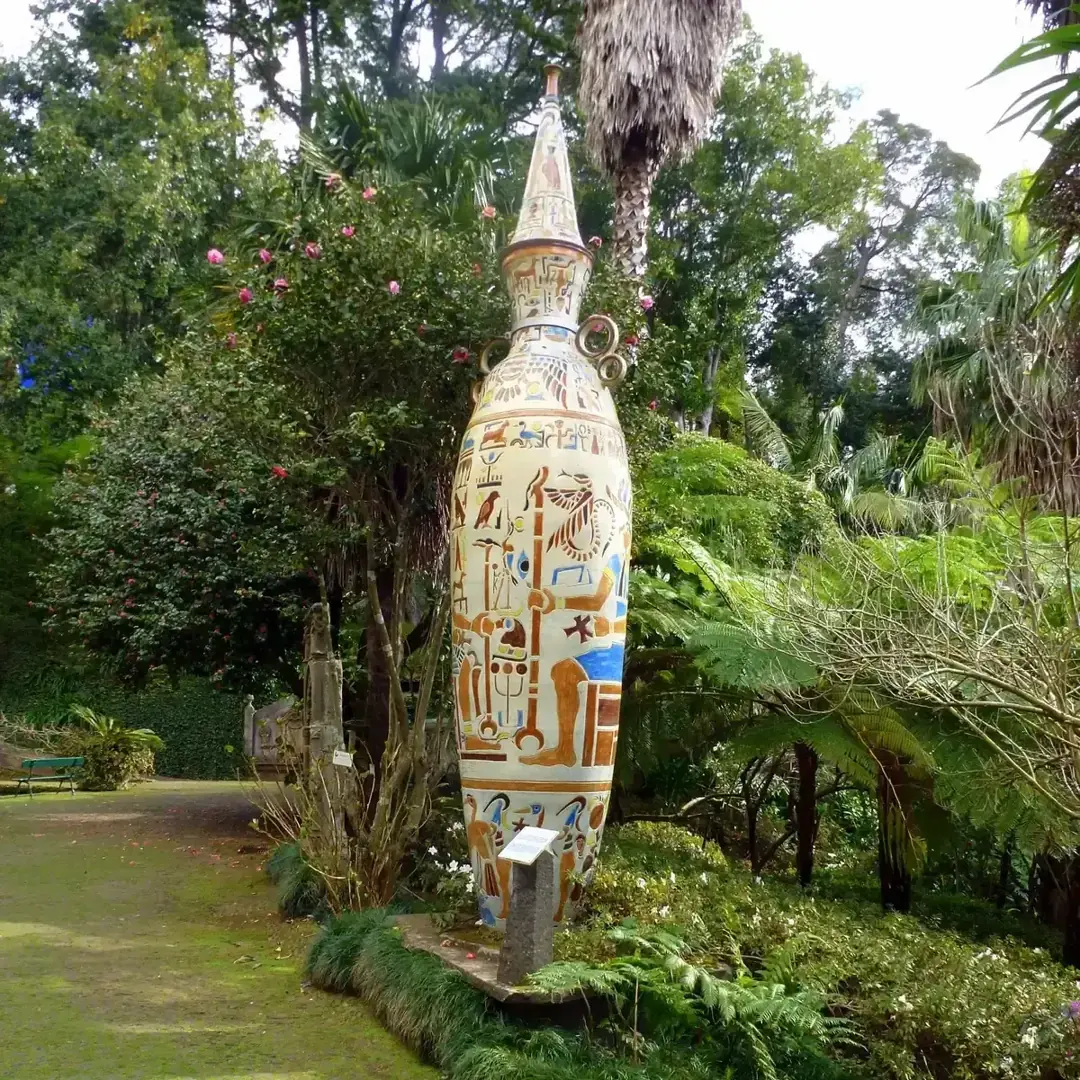A large decorative ceramic urn among tree ferns and palms at Monte Palace Tropical Garden near Funchal, Madeira