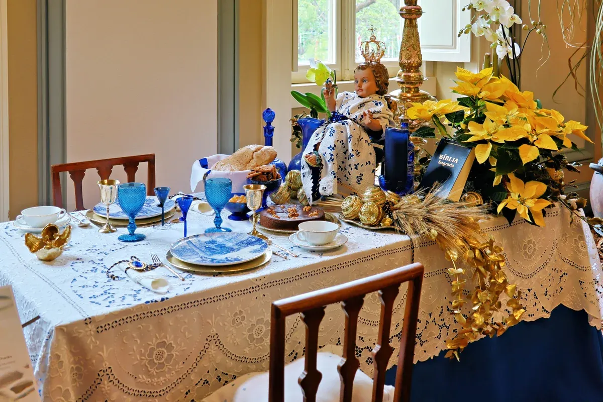 A finely embroidered blue and white table setting showing genuine Madeira embroidery lacework detail in Funchal, Madeira, Portugal