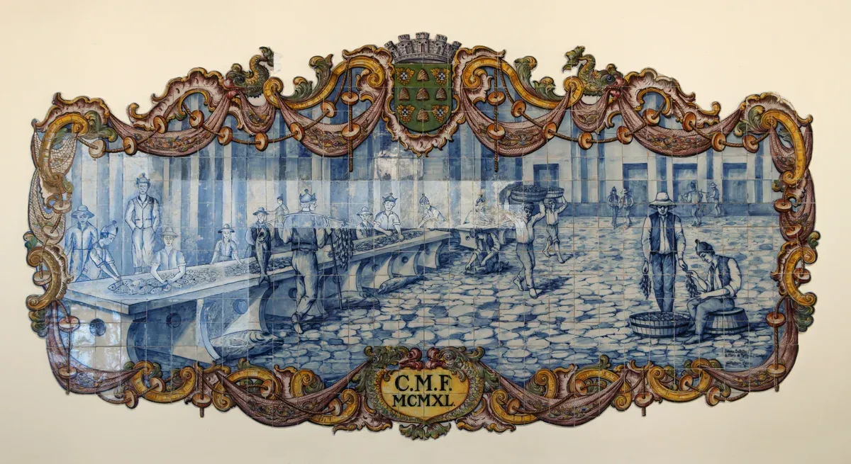 An Art Deco ceramic tile panel by Joao Rodrigues showing market porters and fish sellers at the Mercado dos Lavradores in Funchal, Madeira, Portugal