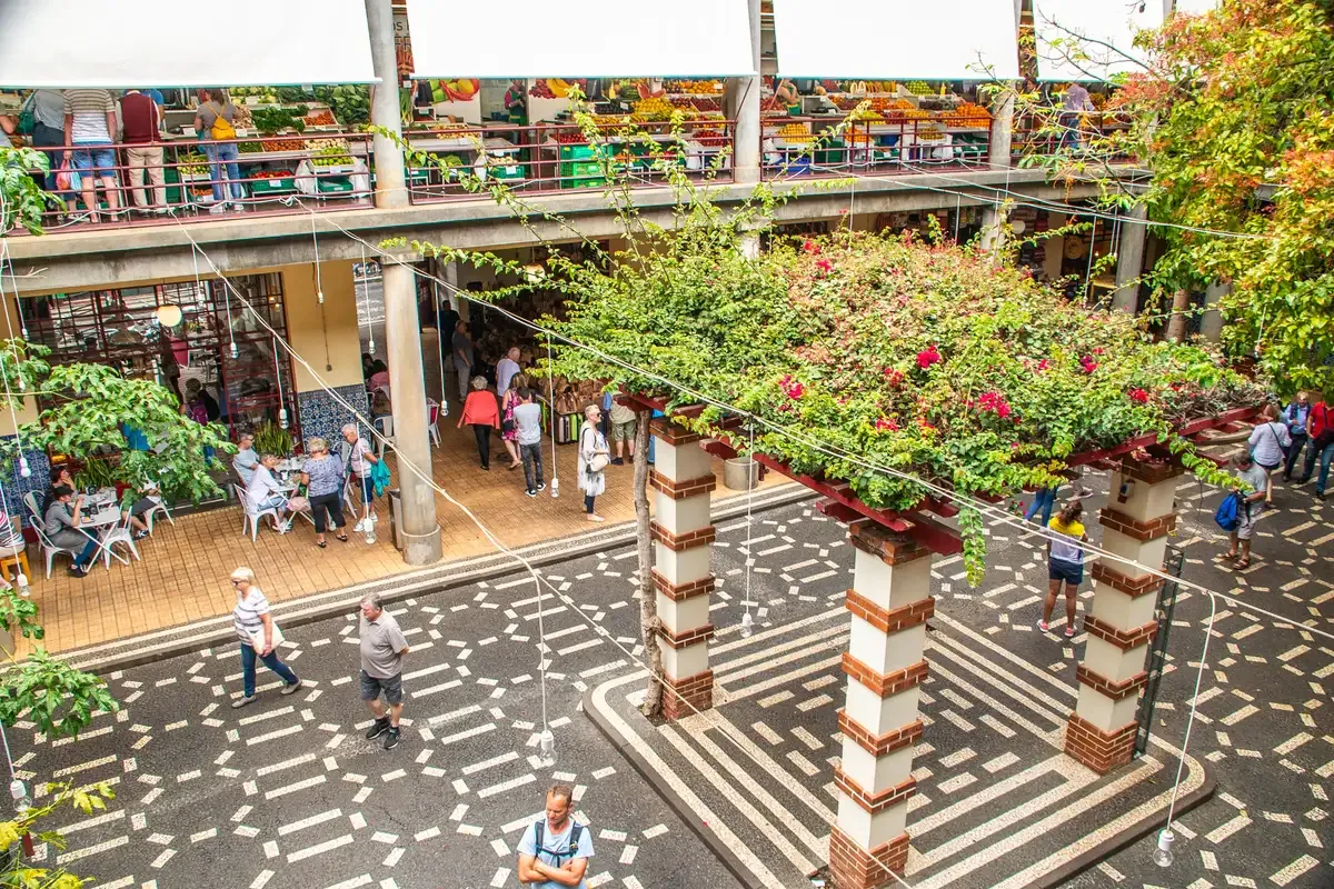 The central courtyard of the Mercado dos Lavradores with fruit stalls on the upper gallery in Funchal, Portugal