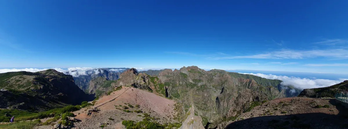 Panoramic ridge view from the Pico do Arieiro viewpoint near Funchal, the summit reached by the official bus and the tours compared on this page