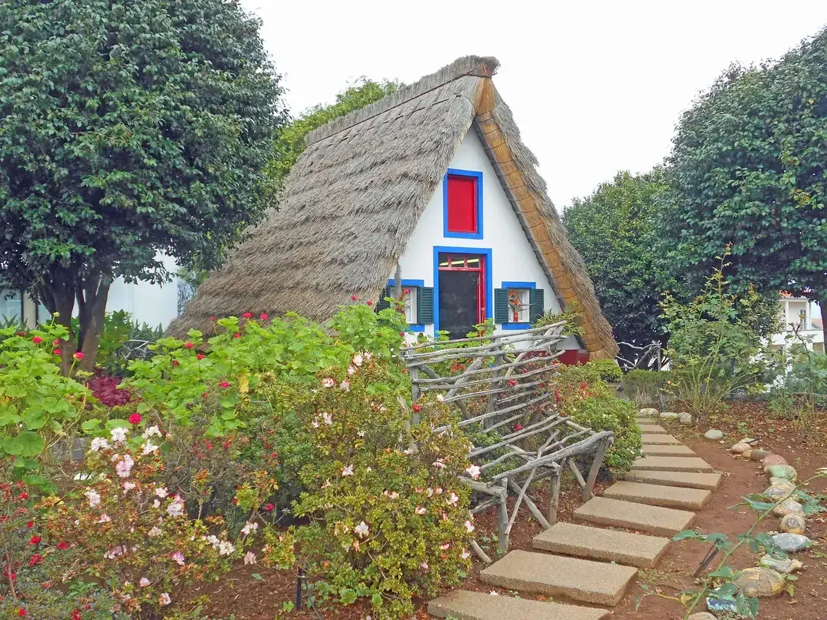 A triangular thatched Casa Típica house in Santana on Madeira's north coast, a day trip destination from Funchal