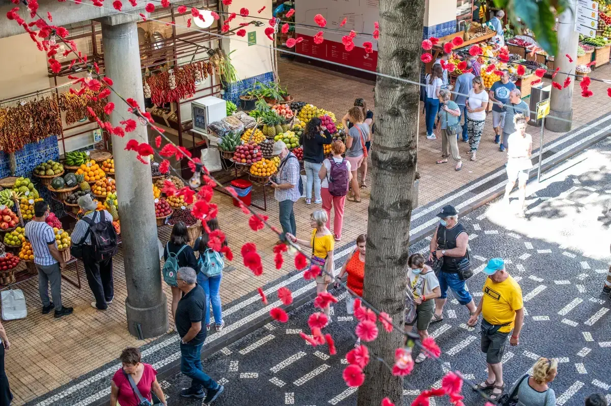 Fresh produce stalls at Mercado dos Lavradores in Funchal, the market where the ingredients behind Madeiran dishes like espetada are sold